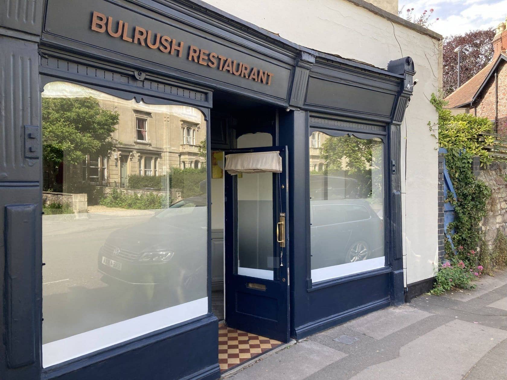 Bulrush's navy shopfront on Cotham Road South, Bristol